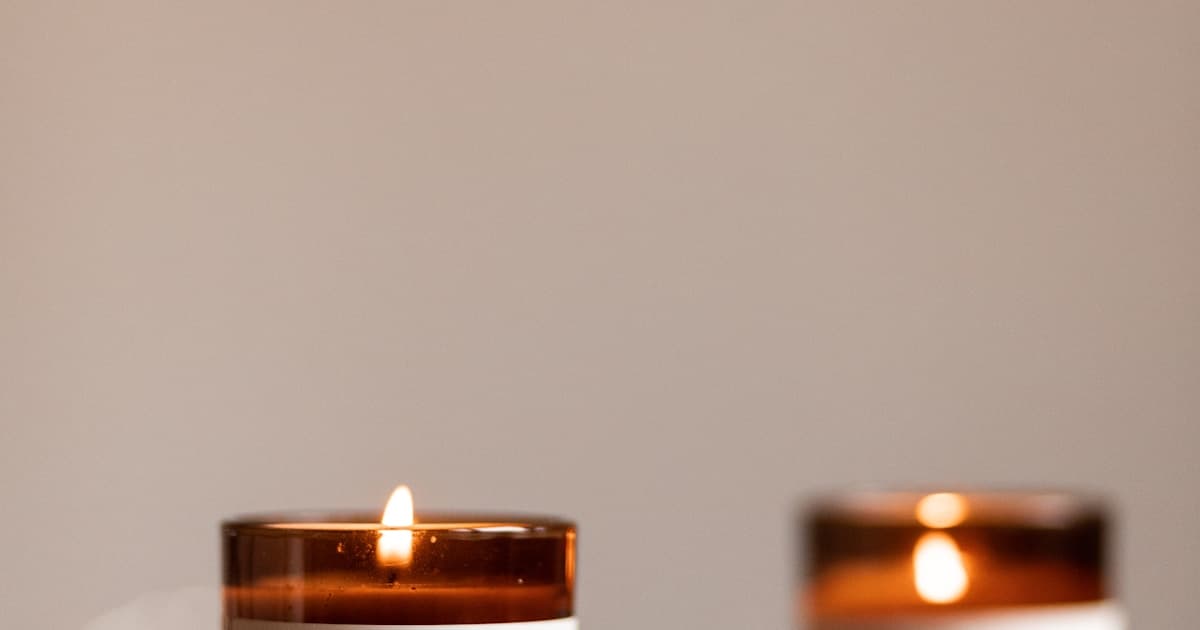 Candle business workshop setup in Dubai with branded candles, packaging materials, and business planning documents